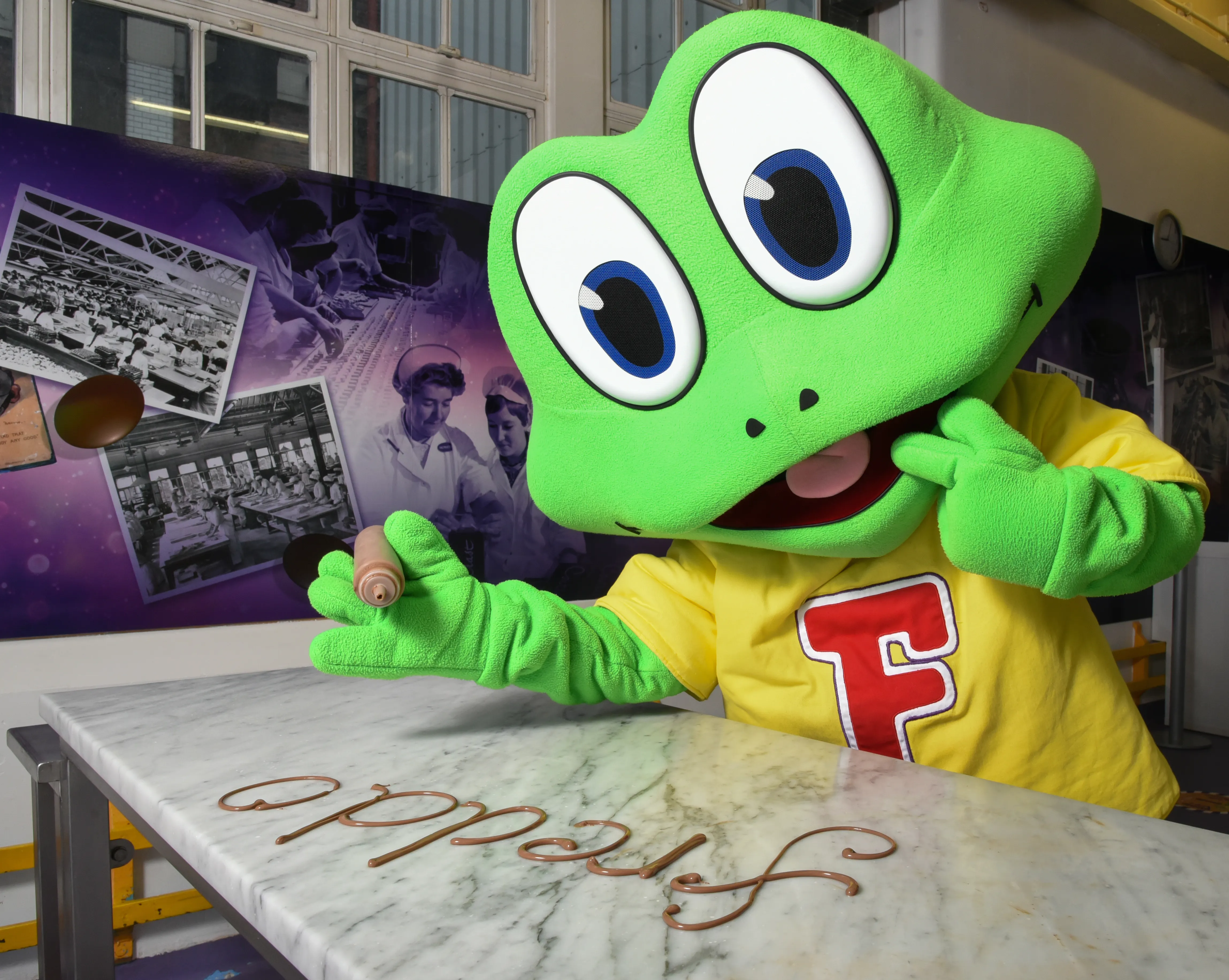 Freddo piping his name with chocolate at Cadbury World